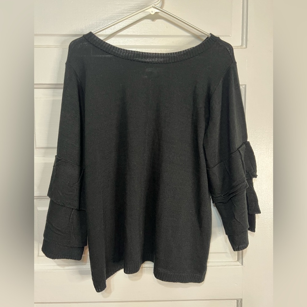 Maurice’s black sweater